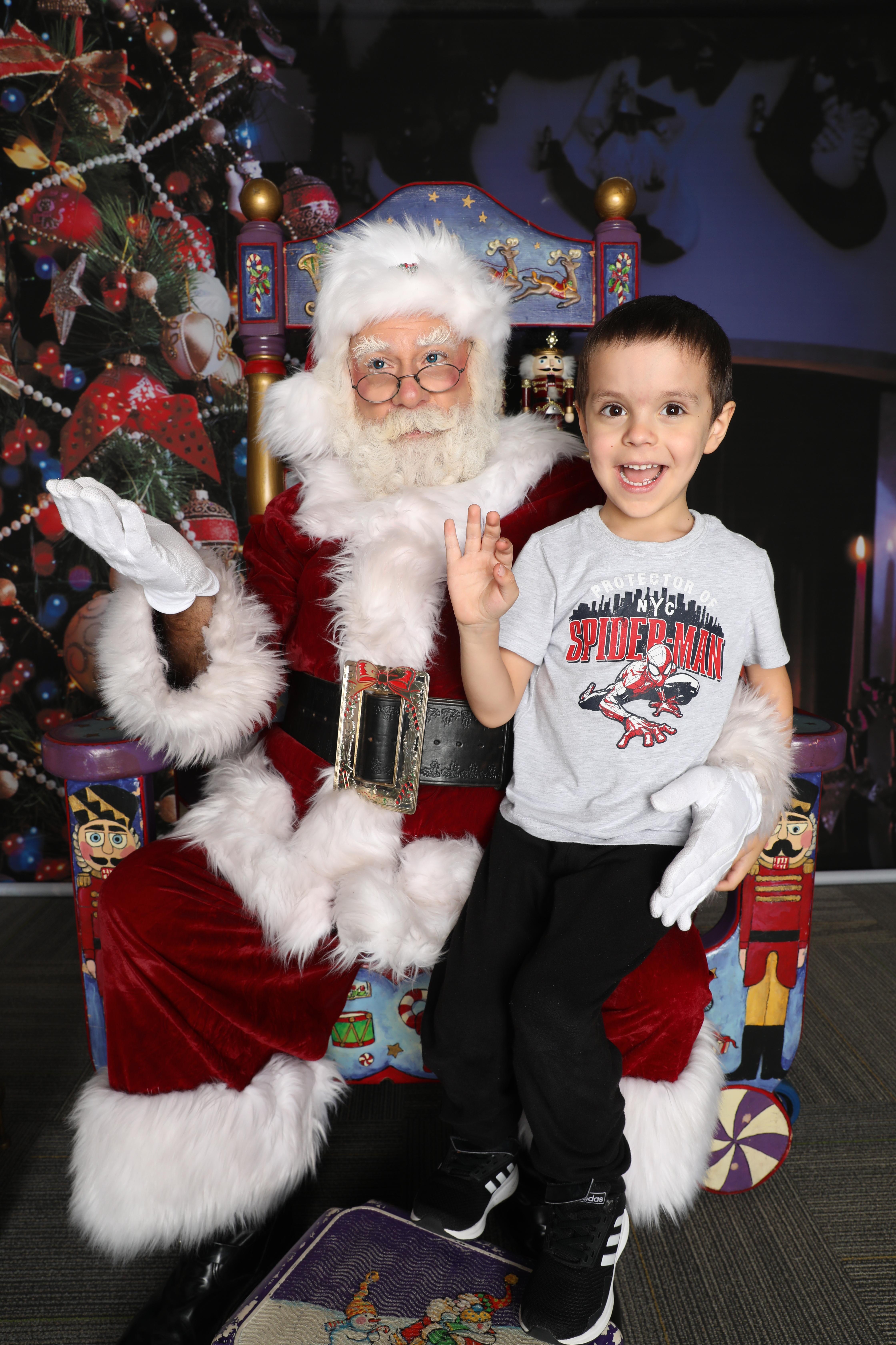 Santa Albert with a child on the awesome custom-made throne.