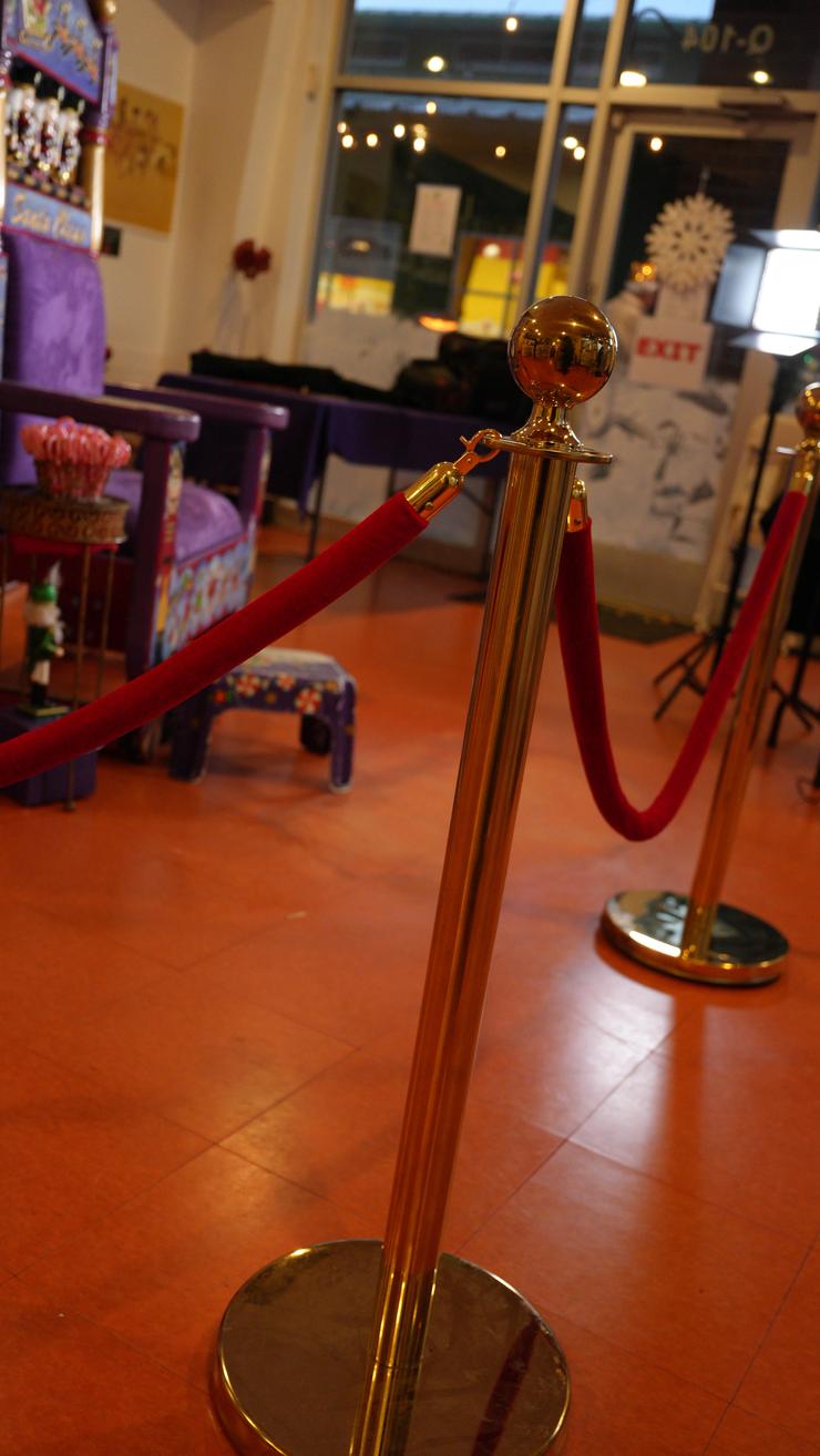 Brass and red velvet stanchions.